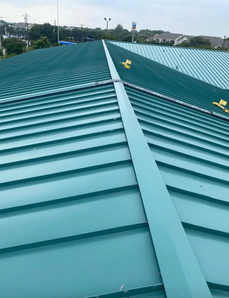 Green commercial metal roof ridge and valley for Metal Roof Repair in Perry Heights
